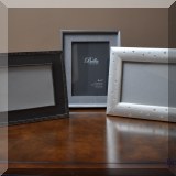 D31. 3 Silvertone picture frames.